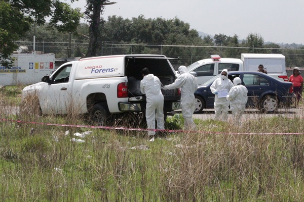 Hallan cuerpo calcinado y sin extremidades en campo de cultivo de Acajete